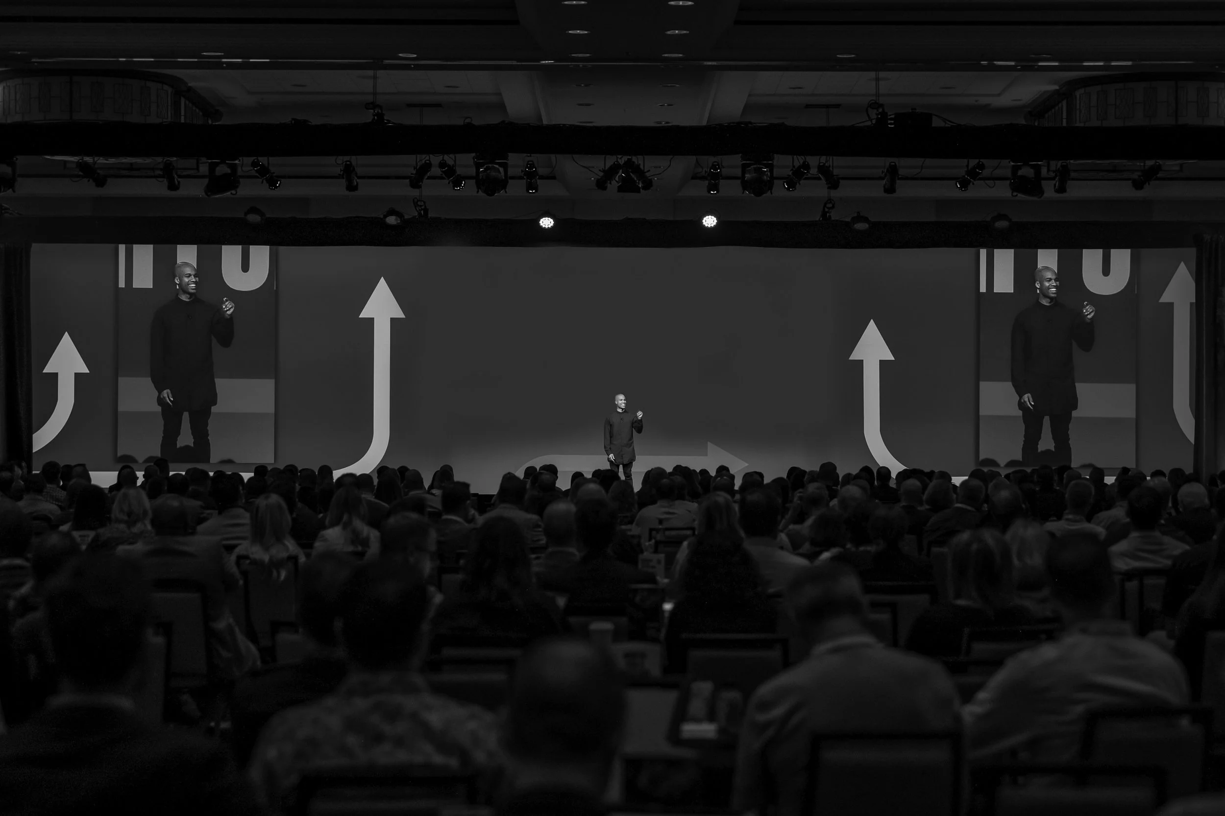 Tucker Bryant speaking on stage